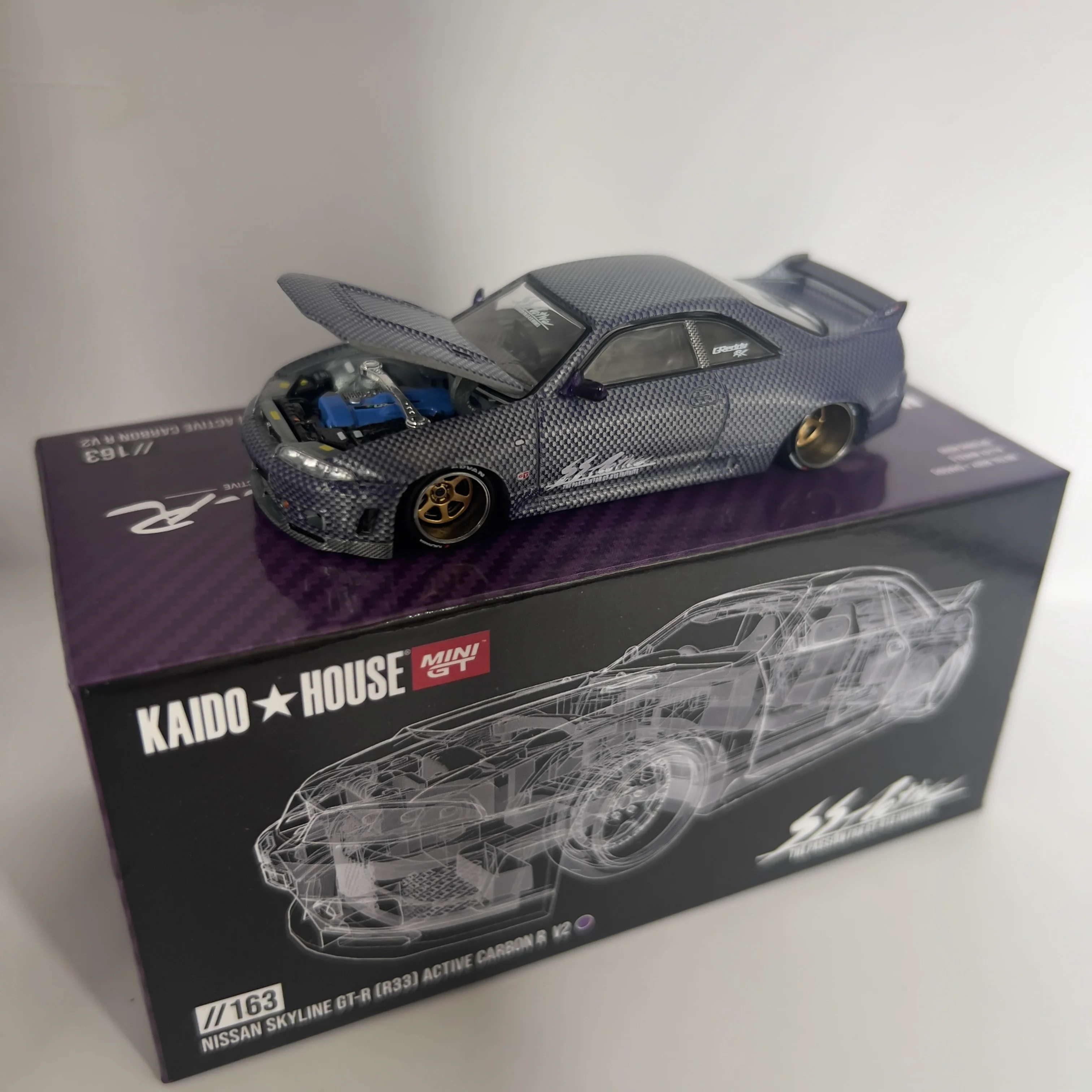 Mini GT x Kaido House Nissan Skyline R33 GTR Active Carbon Chase #163 - Image 3