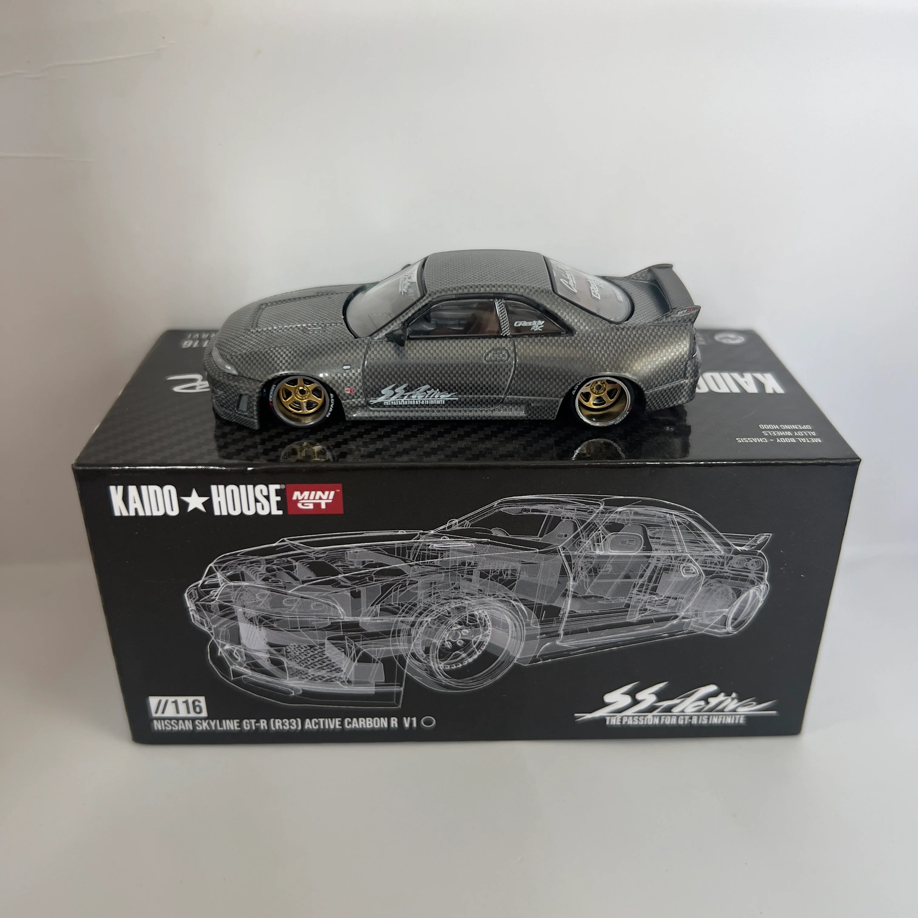 Mini GT x Kaido House Nissan Skyline R33 GTR Active Carbon V1 Chase #116