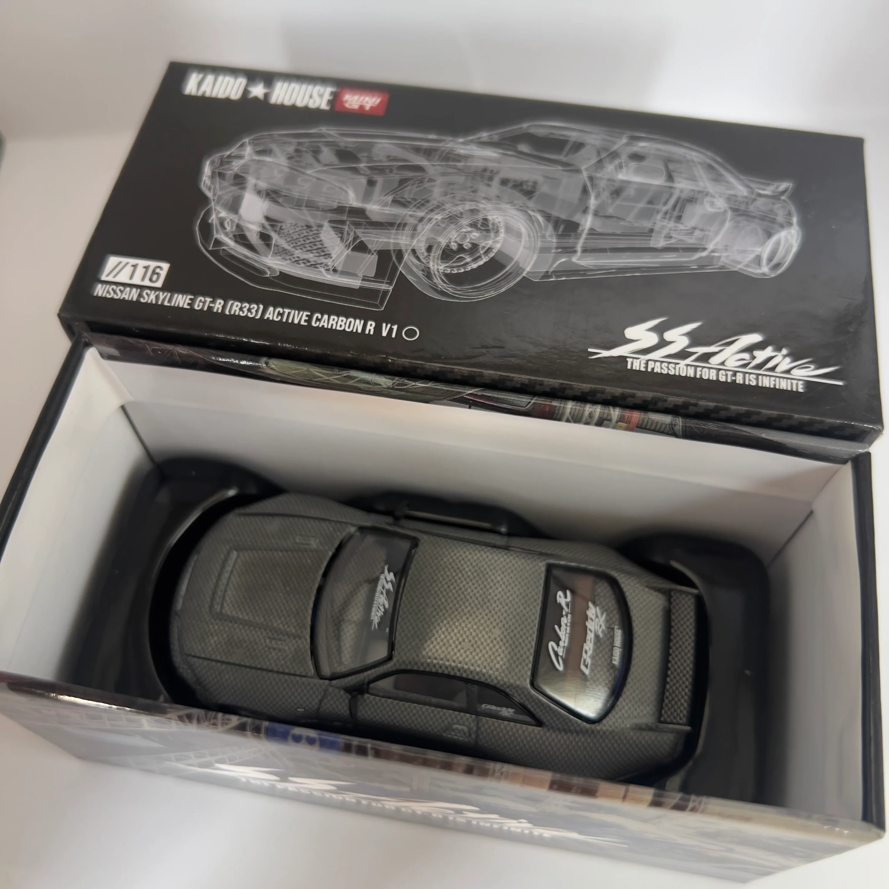 Mini GT x Kaido House Nissan Skyline R33 GTR Active Carbon V1 Chase #116 - Image 3